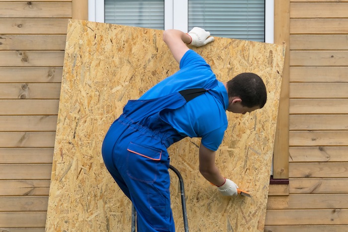 board up windows to prepare your home for hurricane season