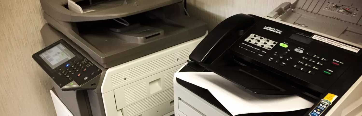 Old office fax machines ready for disposal