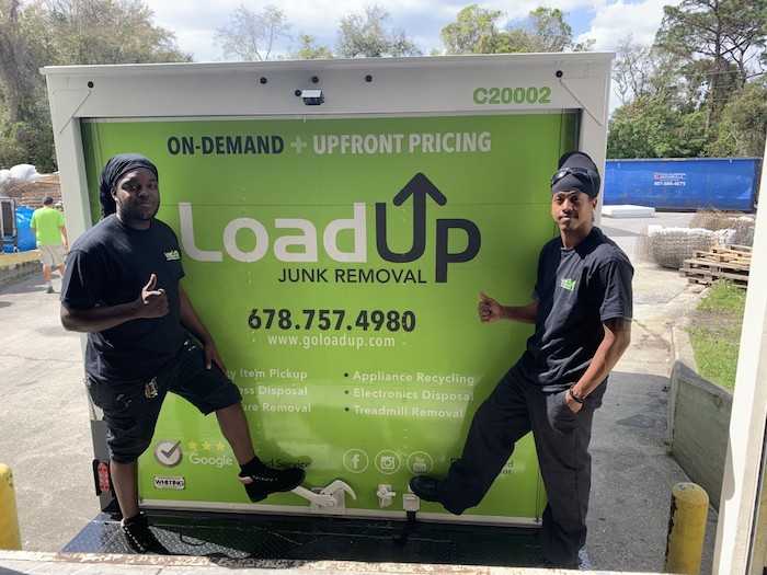 LoadUp team members happily donate picked up furniture in Orlando