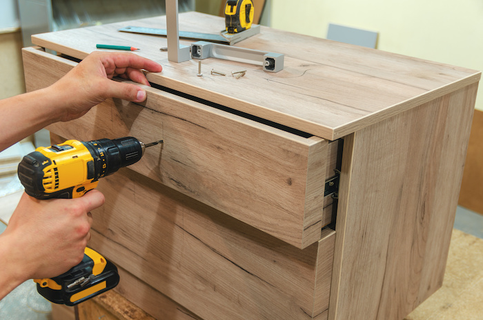 Professionals assembling furniture