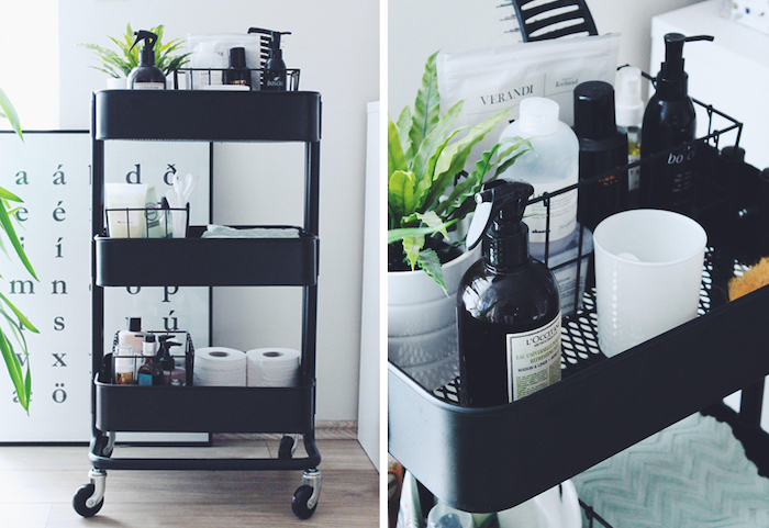 A rolling cart being used as bathroom storage