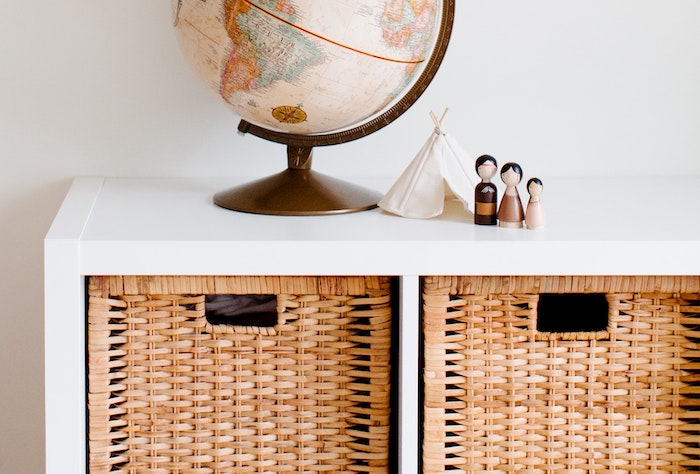 white cubbies with brown bins used to increase storage in small spaces