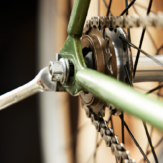 professional with tools building bicycle