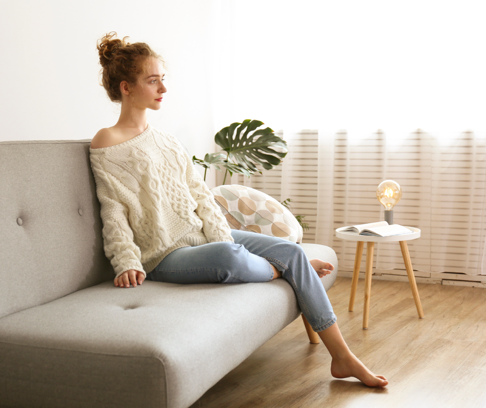 Woman sitting on newly assembled futon
