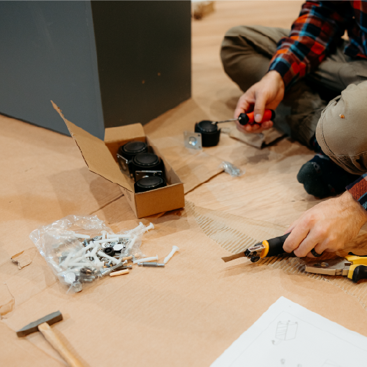 professional with tools building toy car