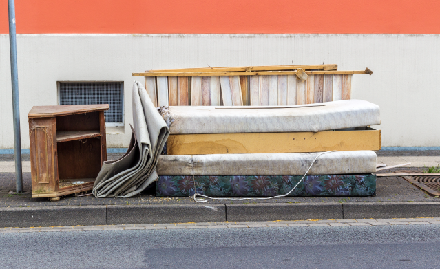Bulk items on the curb needing a reliable pickup and removal service