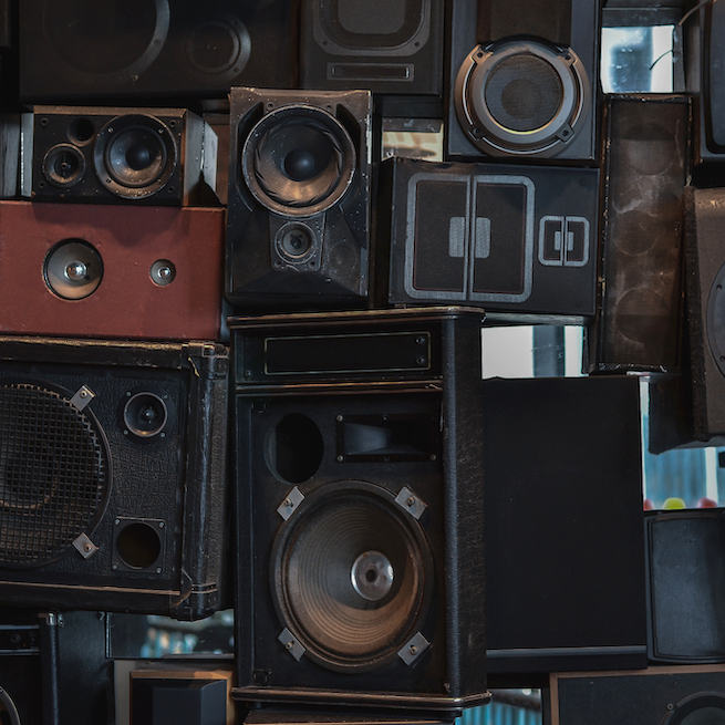 Wall full of various large speakers