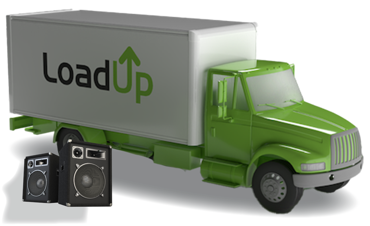 Two broken speakers next to a junk removal truck ready for removal