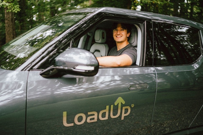 LoadUp driver arriving to a customer's home in a LoadUp branded pickup truck