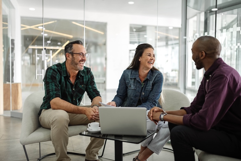 Group of coworkers collaborating on system improvements