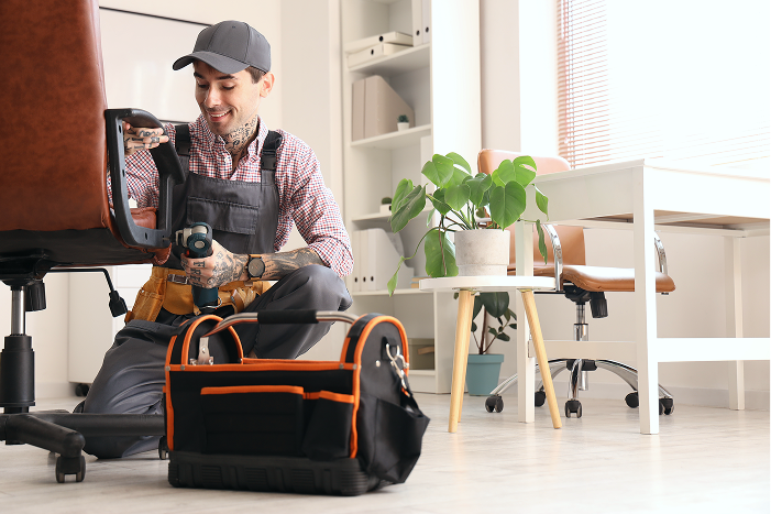 Handy man assembling office furniture for a B2B partner